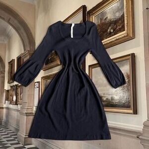 Black ribbed knit midi dress with flattering cinch waist and soft puff sleeves ✨